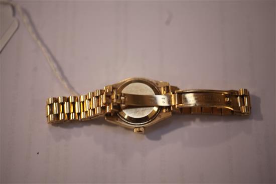 A ladys modern 18ct gold and diamond set Rolex Oyster Perpetual Datejust wrist watch,